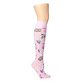 Knee-high pink compression socks featuring Snoopy and beach-themed designs.